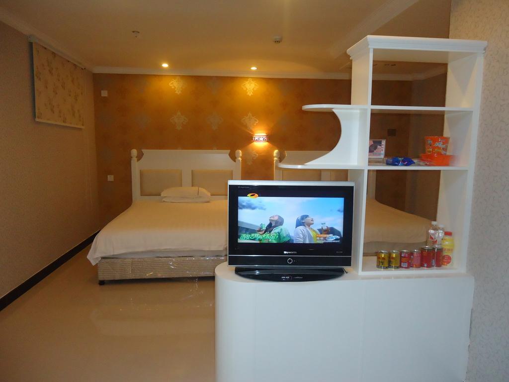 Omeiga Business Hotel Іу Номер фото